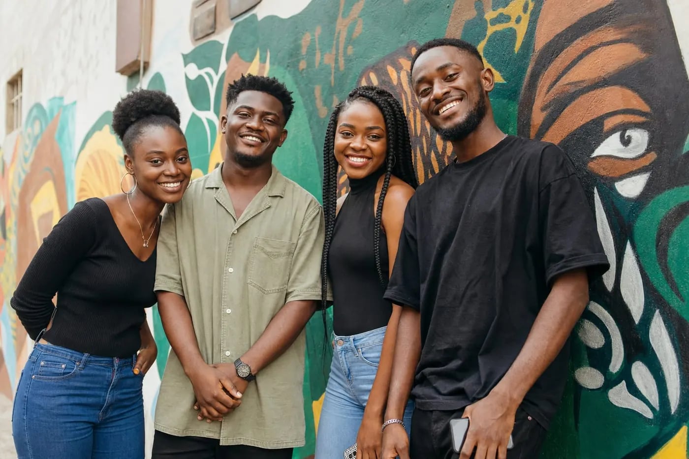 Young Ghanaian friends saving together with the Kims Susu app